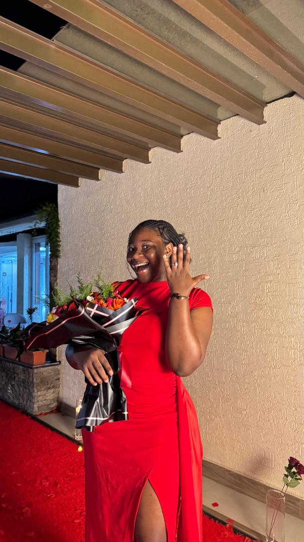 Woman in red dress with flowers