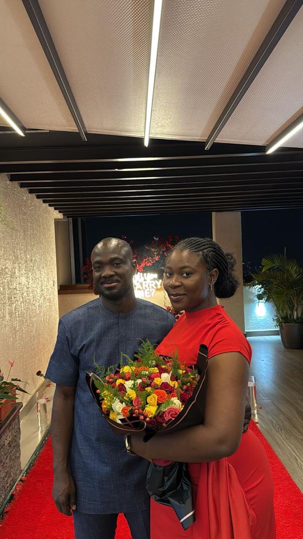 Couple under architectural beams